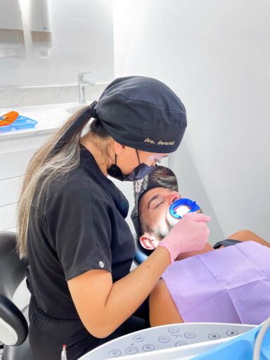 Dr. Plácito performing Zoom Whitening treatment